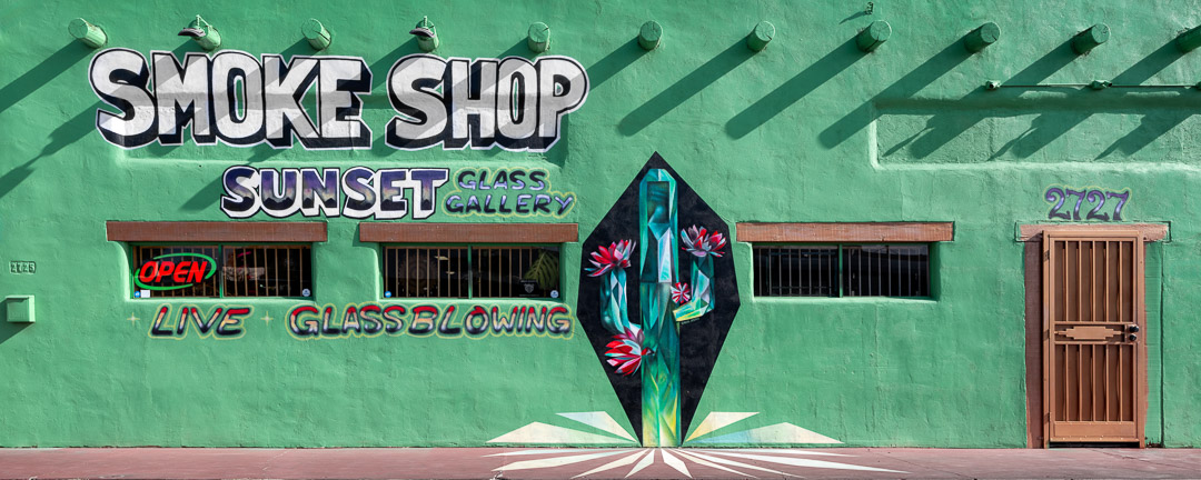 Painted side of Smoke Shop Sunset Glass Gallery with crystal-like saguaro. Tuscon.
