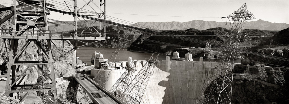 Hoover Dam's massive concrete structure and power lines, part of Western Power.